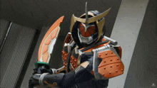a man in a samurai costume is holding two swords in his hands