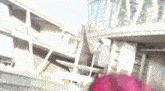 a blurred image of a building with a red object in the foreground