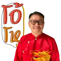 a man wearing glasses and a red shirt with a dragon on it stands in front of a sign that says to the
