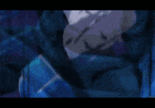 a blurry picture of a person 's face with a blue background