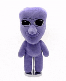 a purple stuffed animal with a big nose and big eyes