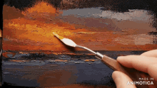 a painting of a sunset is being made in animatica