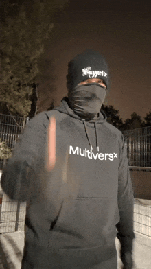 a man wearing a black hoodie that says multiverse
