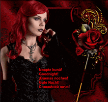 a woman with red hair is standing in front of a red rose and says goodnight