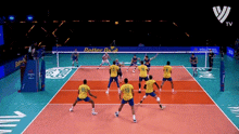 a volleyball game is being played on a court with better be written on the wall
