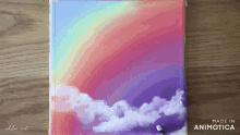 a painting of a rainbow and clouds is made in animatica