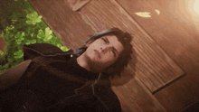 a video game character is laying down on the ground