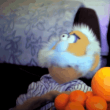 a cartoon character with a beard is holding oranges in his hand