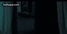 a blurred image of a window with the words kulfyapp.com on the bottom right