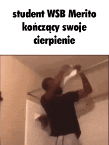 a picture of a man in a black shirt with the words student wsb merito written above him