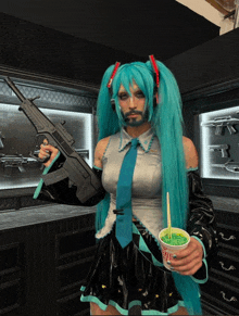 a man in a hatsune miku costume is holding a gun and a cup of green noodles