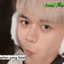 a close up of a person 's face with lucas ' thighs written on the bottom right