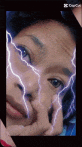 a picture of a girl with lightning bolts on her face and the caption capcut
