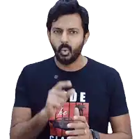 a man with a beard wearing a black t-shirt that says " de " on it