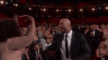 Oscars High Five John Legend GIF - Oscars High Five Hug GIFs