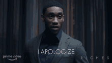 a man in a suit says i apologize