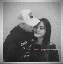 a man kisses a woman on the cheek with the words now i got you in my space