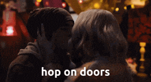 a couple kissing with the words hop on doors written below them