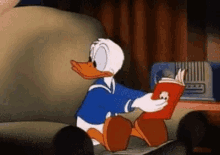 Reading Book GIF - Reading Book Donald Duck GIFs