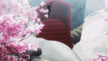 a red staircase is surrounded by pink flowers and snow