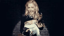 Madonna Breast Feed GIF - Madonna Breast Feed Baby Sitting GIFs
