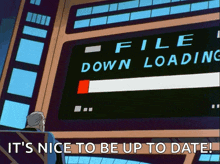a man sits in front of a computer screen that says file down loading