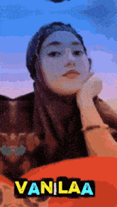 a woman wearing a hijab with the name vanilaa on the bottom