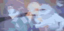 a blurry picture of a person holding another person