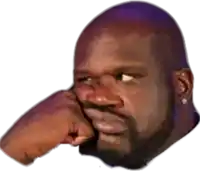 a bald man with a beard is holding his fist to his face and making a funny face .