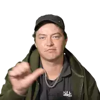 a man wearing a black hat and a shirt that says ekk