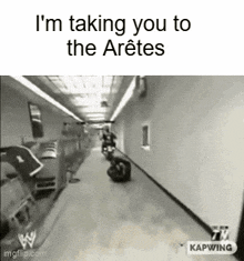 a black and white photo of a hallway with the caption i 'm taking you to the aretes .