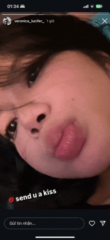 a screenshot of a woman 's face with the words send u a kiss