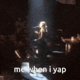a woman singing on stage with the words me when i yap