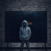 a man wearing a white hoodie and a black mask
