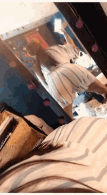 a woman taking a selfie in front of a mirror that says ' amanda ' on the bottom