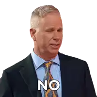 a man in a suit and tie has the word no on his chest