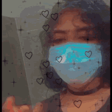 a girl wearing a face mask with hearts on it