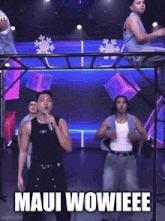 a man singing into a microphone with the words maui wowieeee written below him