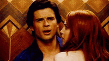 a man and a woman are standing next to each other .