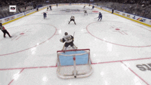 a hockey game is being played on a rink with a poker stars advertisement on the ice