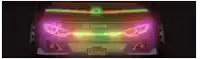 a close up of a car 's headlights with neon lights on it .