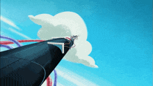 a roller coaster with a cloud in the background