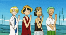a group of four anime characters are standing next to each other .