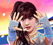 a woman wearing a ponytail and blue gloves is making a face .
