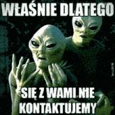 a couple of aliens giving the middle finger with a foreign language caption