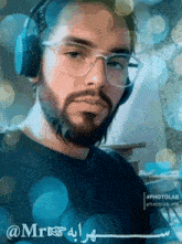 a man with a beard wearing headphones and glasses has the name mr. on the bottom right