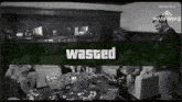 a black and white photo of people sitting in a living room with a green banner that says wasted