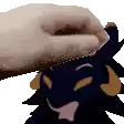 a person petting a stuffed animal with horns on its head
