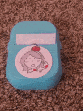 a drawing of a girl with an apple on her head is on a blue box
