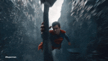 a blurred image of superman with the hashtag #superman